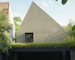 Cinere House: Welcoming Joy with Concrete Door