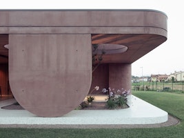 Romantic Serenity: Embracing Sweetness in the Light Red Concrete House